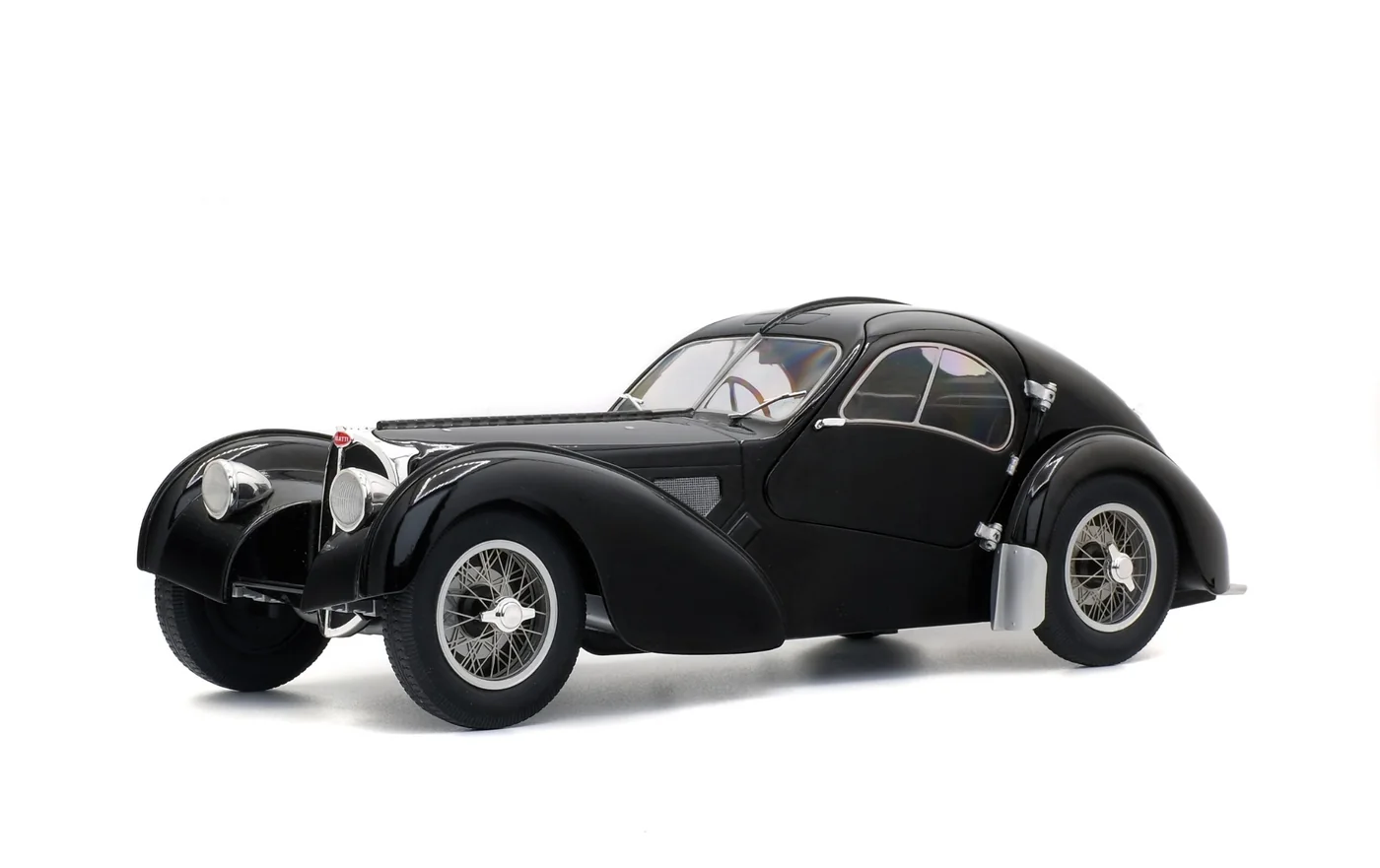 Black streamlined classic Bugatti coupe on a studio background