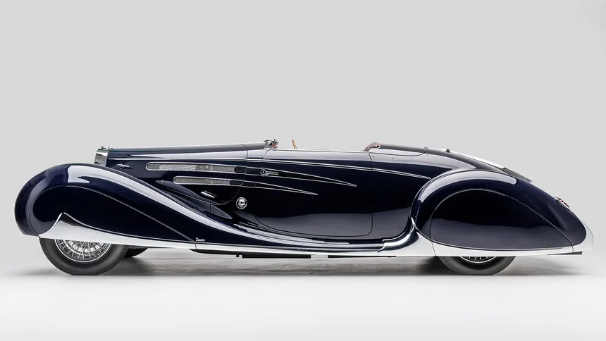 Long black classic Bugatti roadster shown from the side